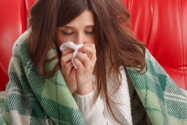 close-up-of-ill-teenager-with-a-tissue-next-to-her-nose_1208-33